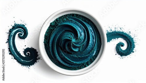 Vibrant Blue Spirulina Powder Swirled in a White Bowl