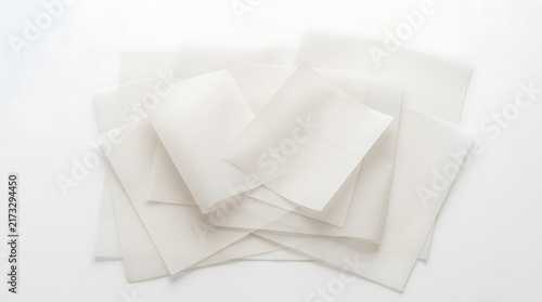 Stack of white paper sheets on a flat surface