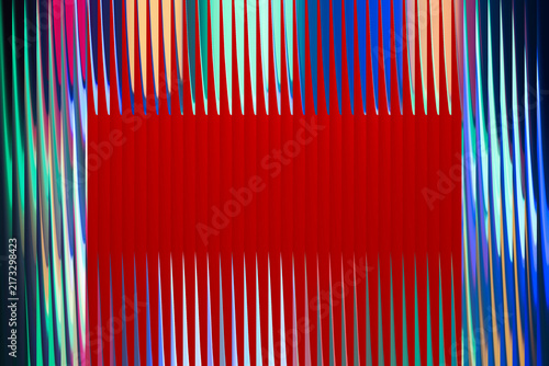 Obraz na plátne Abstract background with vertical colorful stripes and a prominent solid red rec
