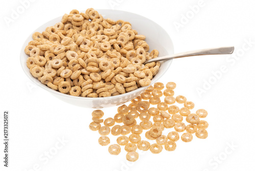 Foto Toasted Oat Cereal Loops in a White Ceramic Bowl with Spoon