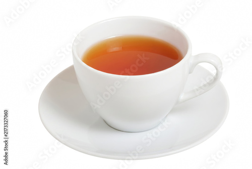 Obraz na płótnie Freshly brewed amber tea in a white porcelain cup and saucer