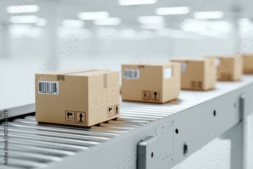 Cardboard parcel boxes moving on automated metal conveyor belt line at modern logistics warehouse facility. Close up view of package delivery, cargo distribution sort system, manufacturing plant