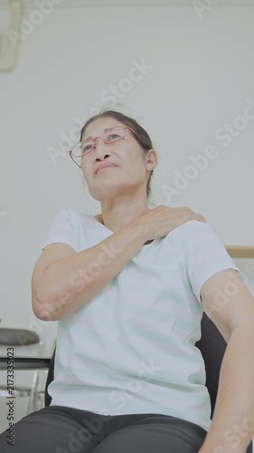 Asian senior woman use hand squeeze nape to relieves symptoms cramps, pain muscle, osteoporosis. Elderly female patient massages shoulder, arm for lifestyle healthcare, arthritis aches. Wellness 