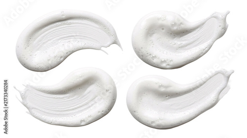 Four cosmetic foam swirls isolated on transparent canvas.