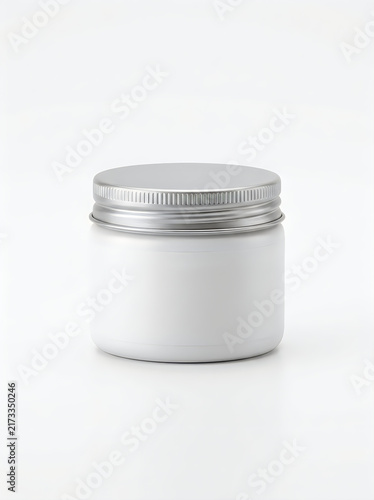 Small white plastic cosmetic jar with a silver screw lid isolated on white background
