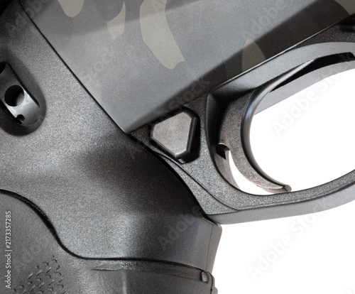 Canvas Print Very large button to disengage the safety faster on a shotgun