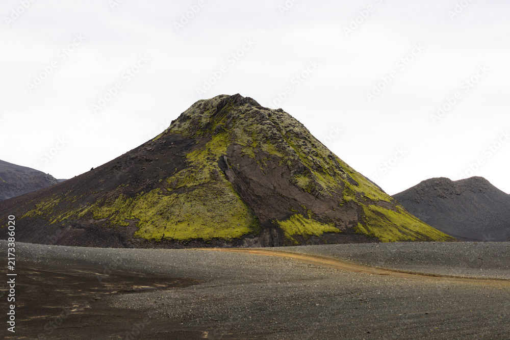 Naklejka premium 4x4 Vehicle Driving Through Rugged Volcanic Highlands of Iceland