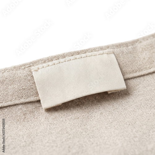 Photography Blank clothing label tag on textured linen on transparent background