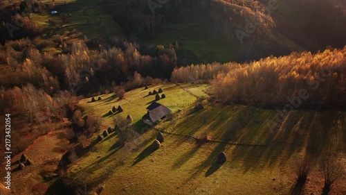 Traditional house and haystacks, autumn in Transylvania,  Romania