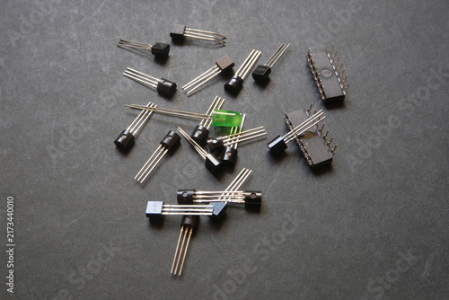 Green LED placed in the middle of a stack of semiconductor materials.