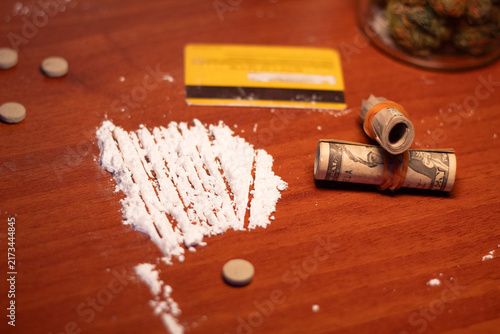 Obraz na płótnie Visual depiction of drug use featuring cocaine, cannabis, pills, and money on a