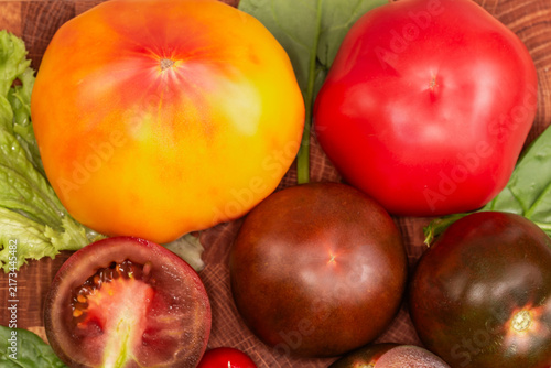 Ripe tomatoes of different varieties, top view close-up