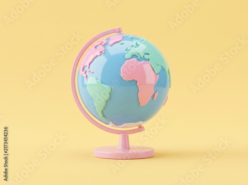 Colorful desktop globe on a pastel yellow background representing global connection and education