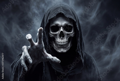 Grim Reaper Skeleton in Black Hood Reaching Out Hand with Smoky Dark Background for Halloween