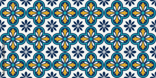 Seamless geometric mosaic pattern with blue and yellow floral motifs on white background, ideal for tiles, fabric, and wallpaper design.