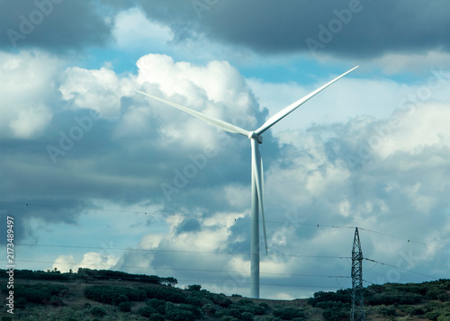 Obraz na płótnie Wind turbine under dramatic clouds