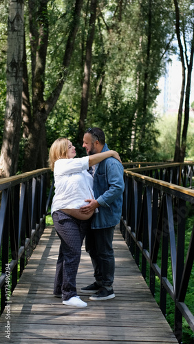 Принти на полотні Expectant Couple Together in the Park, Pregnant Woman and Partner, Family Love,