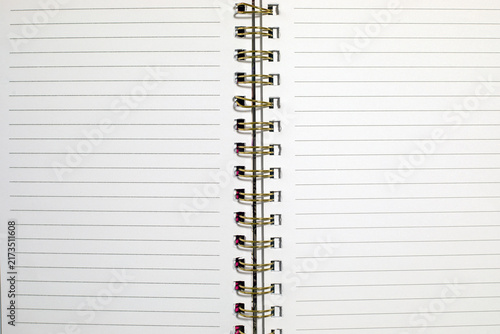 фотографія Back to school open spiral notebook with blank lined pages spread wide, showing