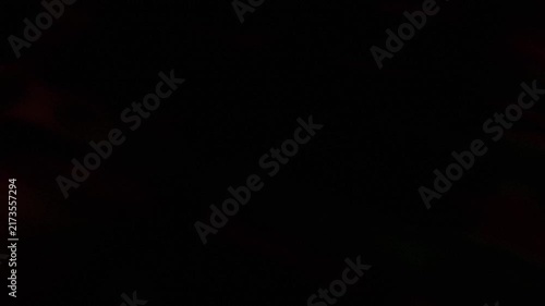 Soft Gradient Abstract Black Motion Graphics Background with Subtle Dark Red and Green Light Leaks Evoking Mystery Digital Space and Ethereal