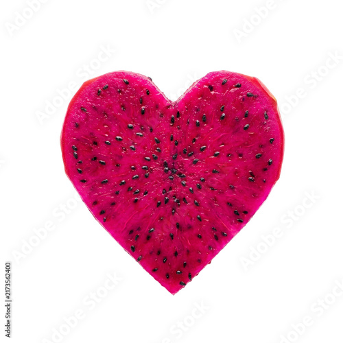 Vibrant pink heart shaped dragon fruit slice isolated on white background, exotic tropical fruit for Valentine, romance, healthy food and creative advertising designs