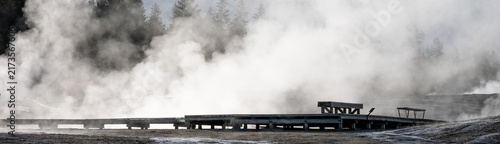 Quadro su tela Early morning walk in upper geyser basin and Old Faithful steaming geothermal fe