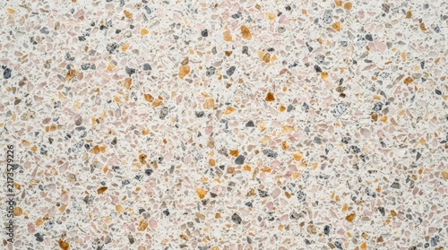 Close up of speckled terrazzo material with aggregate chips