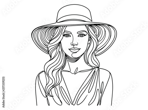 Elegant woman wearing wide brimmed hat and flowing hair