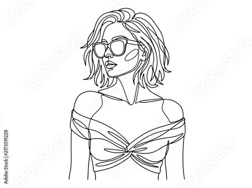 Fashionable woman with sunglasses and crossed arms pose
