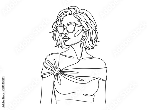 Fashionable woman with sunglasses and tied top
