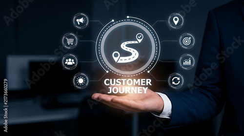 Businessman holding a futuristic digital hologram representing customer journey