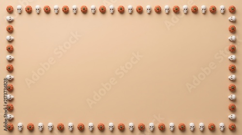 A decorative rectangular border made of small red and white beads on a soft beige background