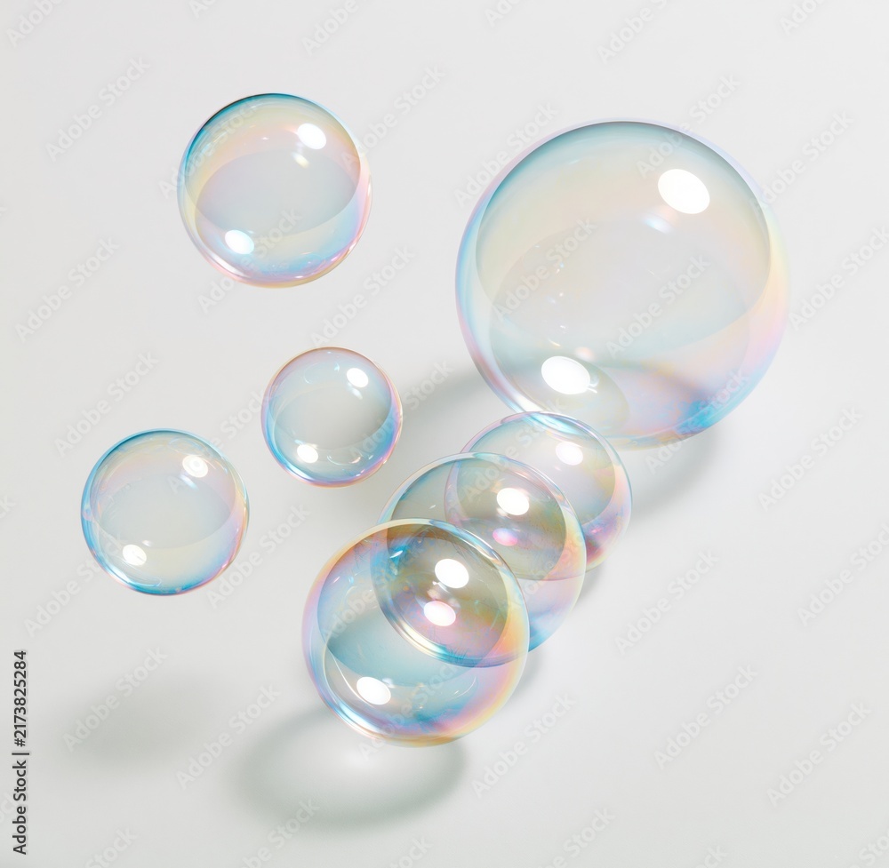 Obraz premium Colorful soap bubbles floating on white background