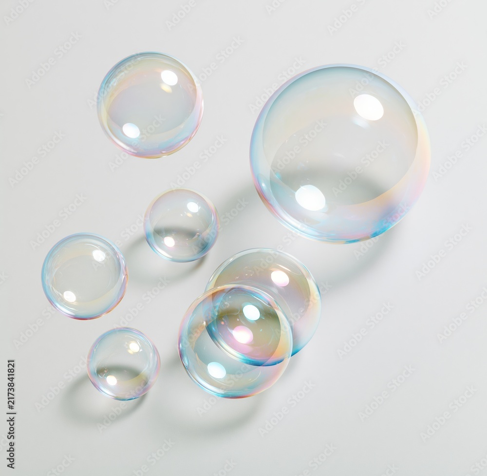 Obraz premium Colorful soap bubbles floating on white background