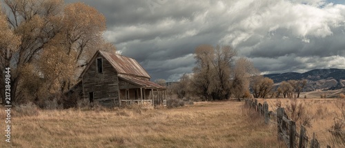 Rustic Barn in a Golden Field Under a Dramatic Sky.