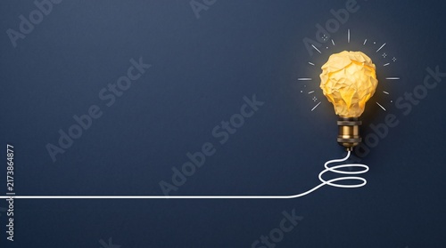 Creative inspiration background with glowing light bulb and large copy space for innovation, ideas and business messaging
