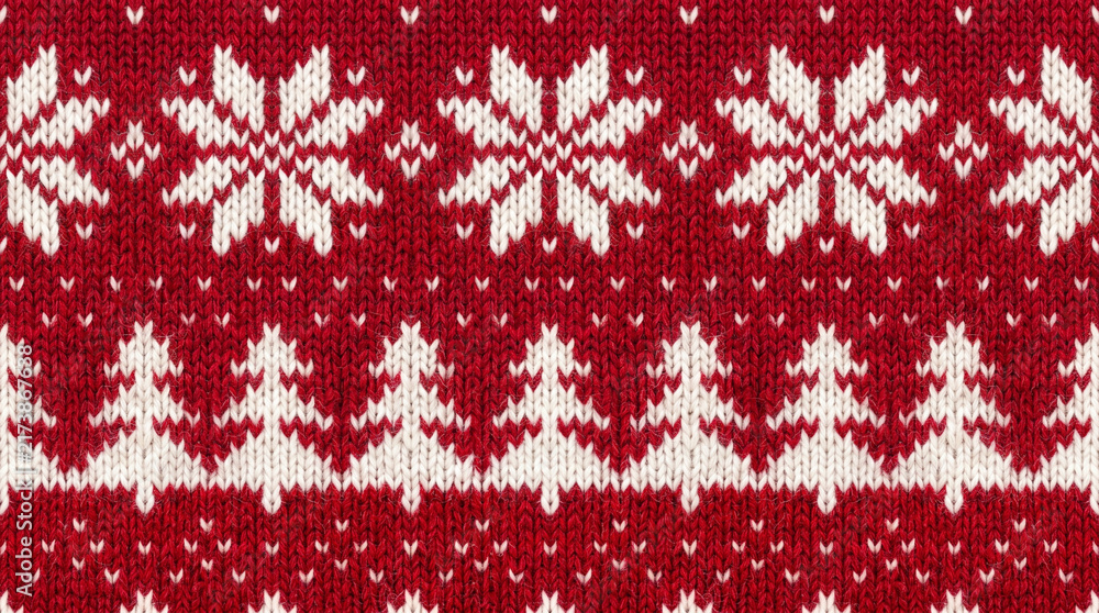 Seamless nordic pattern with snowflakes and fir trees on a red background