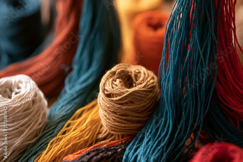 Close‑up of bright skeins and reels of yarn