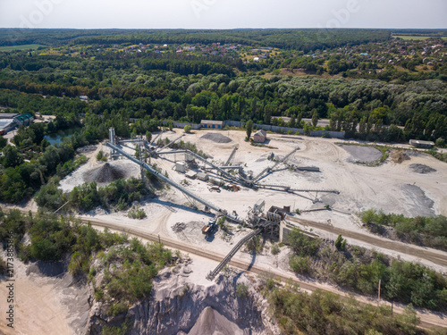 Принти на полотні Wide drone shot captures active stone crushing plant with conveyor systems, heav