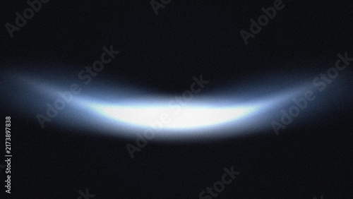 Abstract glowing blue arc light effect with grainy texture on a dark black background wallpaper