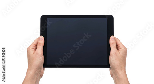 Obraz na plátně Hands holding a black tablet computer with a blank dark screen