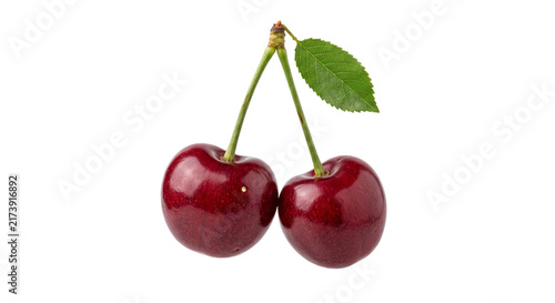 Foto Two ripe dark red cherries with a green leaf and stems on white background