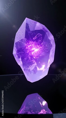 Rotating Amethyst Crystal with Glowing Core, Slowly Spinning Against a Dark Background, Showcasing Its Facets and Internal Light.
