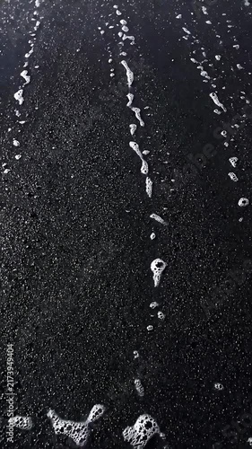 Ocean Foam Cresting and Receding in a Dynamic Looping Animation. Black and White Footage of Turbulent Water Movement.