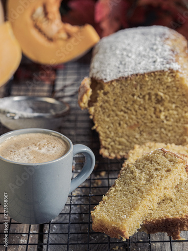 Pumpkin cake with a coffee. A warm autumn snack.
