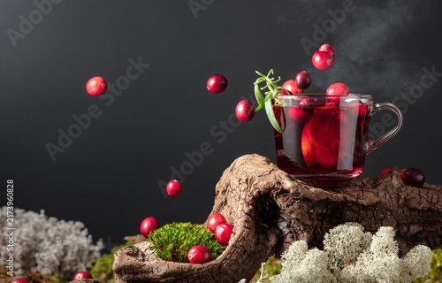 Konstfotografi Hot drink with cranberries, lime, and rosemary.