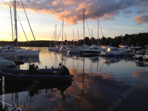 Small Sailboats and Motorboats Moored in a Peaceful Harbor at Sunset, Sweden