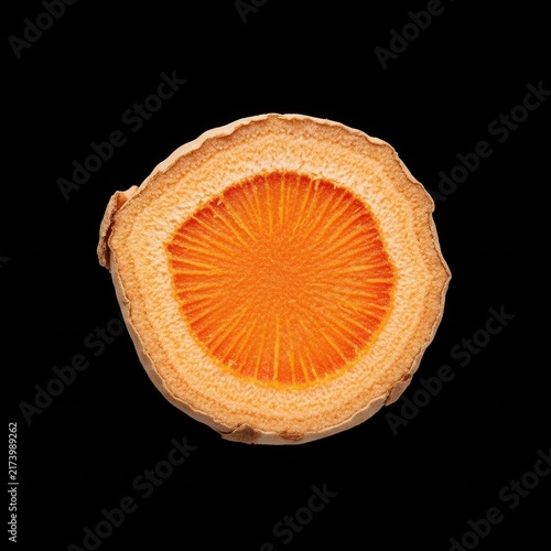 Vibrant Turmeric Root Slice Vivid Orange Center Isolated Black Background