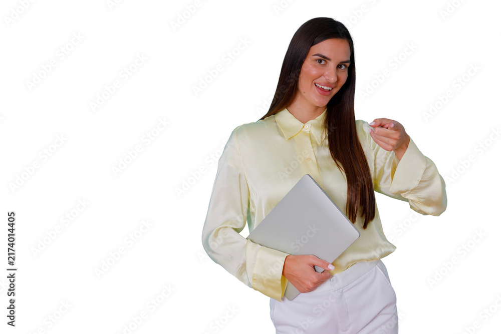 Fototapeta premium Businesswoman holding laptop, smiling and pointing, symbolizing success, confidence, and professional leadership