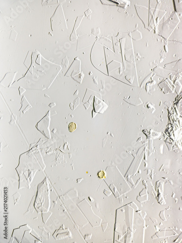 Honey crystals with pollen grains viewed under microscope. Pollen grains appear as yellow spheres amid transparent honey structures