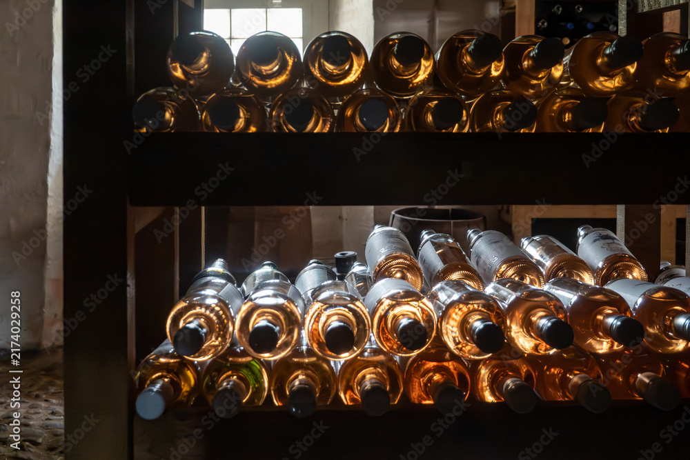 Obraz premium Gram, Denmark Old wine bottles in a wine rack in a cellar.